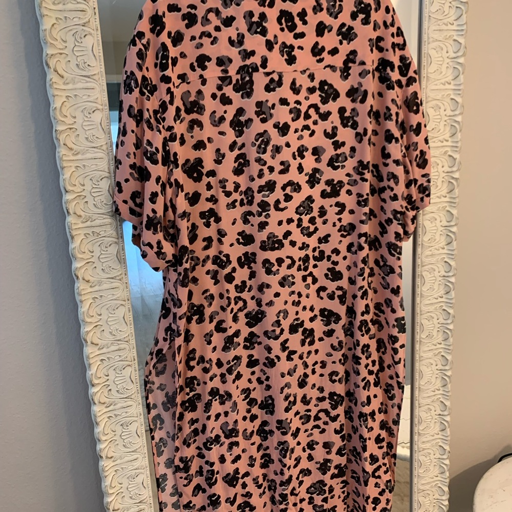 Coral with cheetah print extra long over-blouse by Anthropologie.